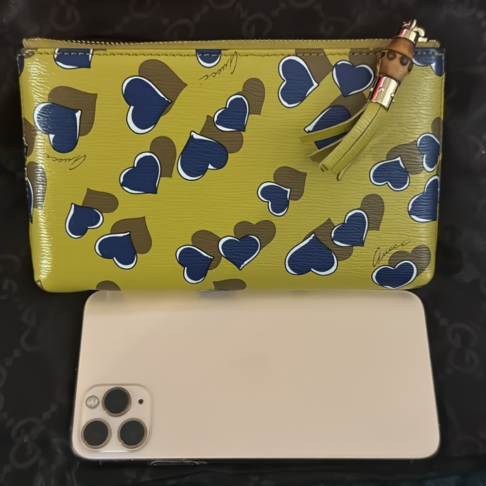Authentic Gucci wristlet with bamboo tassle in excellent condition